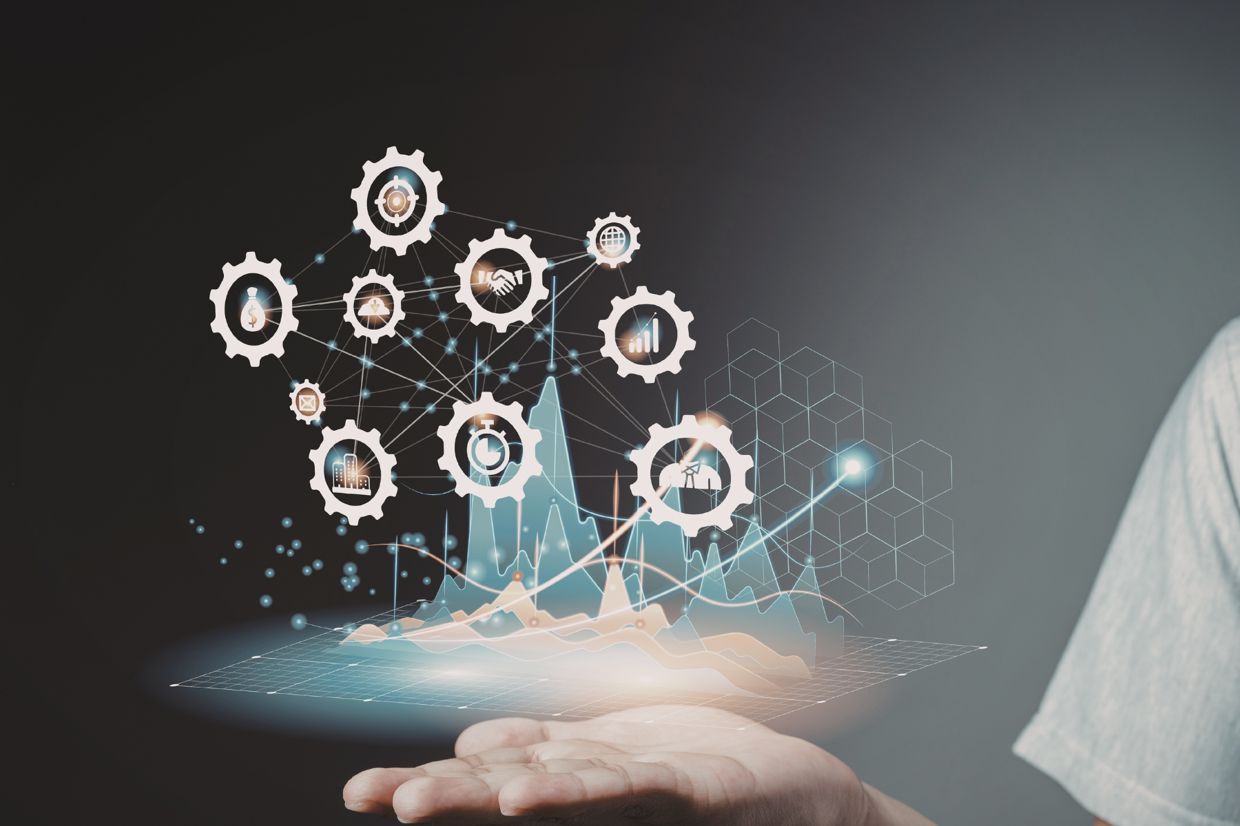 Zdjęcie dłoni na której unosi się holograficzna projekcja danych 3D